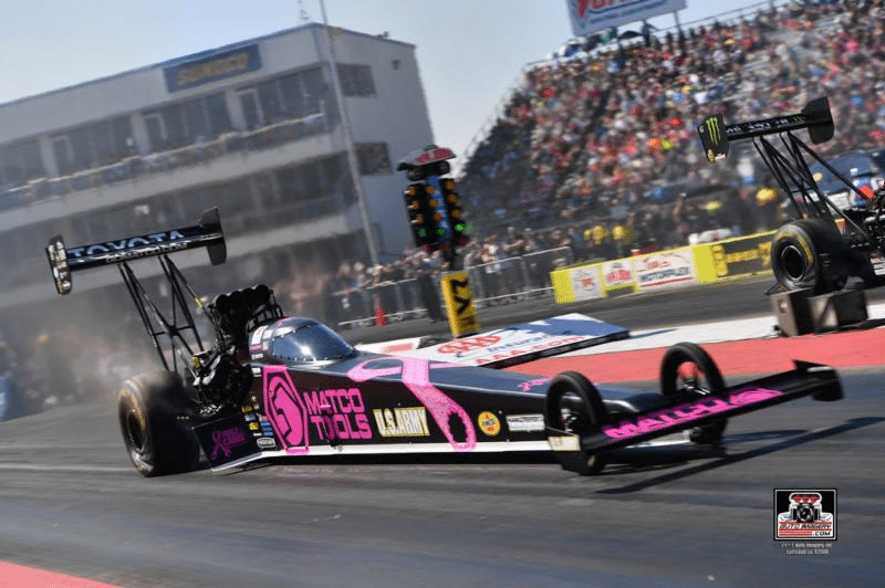Brown advances to semifinals at the Texas Motorplex near Dallas but misses chance to gain ground on Countdown playoff points leader
