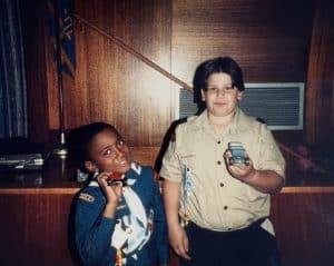 Antron-Brown-as-a-Cub-Scout-holding-pinewood-derby-car-300x239.jpeg